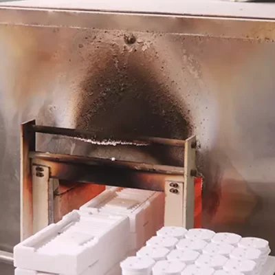 Ceramic green body sintering and exiting the furnace