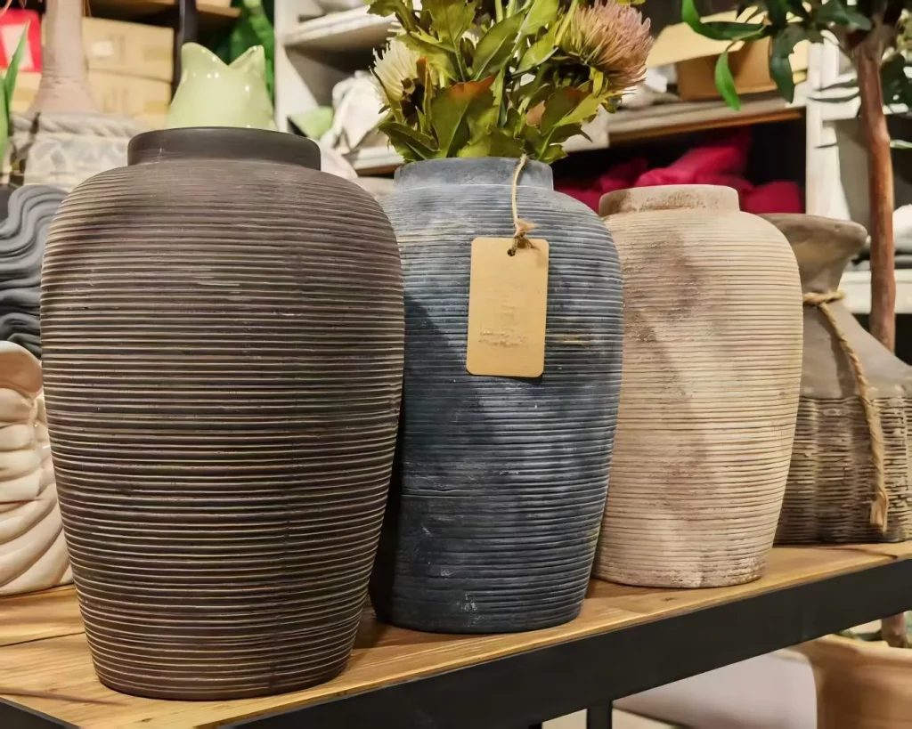 Ribbed ceramic vases that hold the quiet beauty of imperfection.