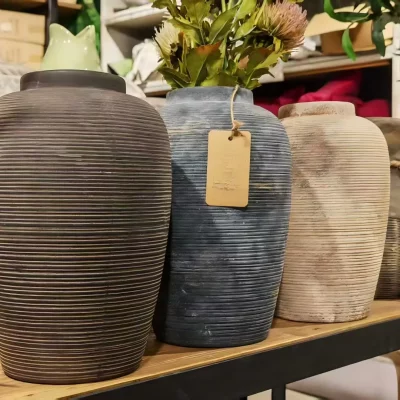 Ribbed ceramic vases that hold the quiet beauty of imperfection.