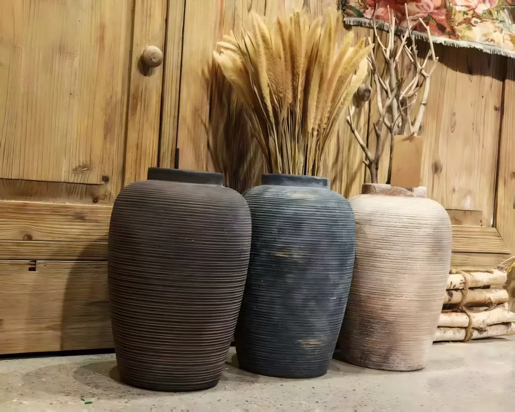 Ribbed ceramic vases that hold the quiet beauty of imperfection.
