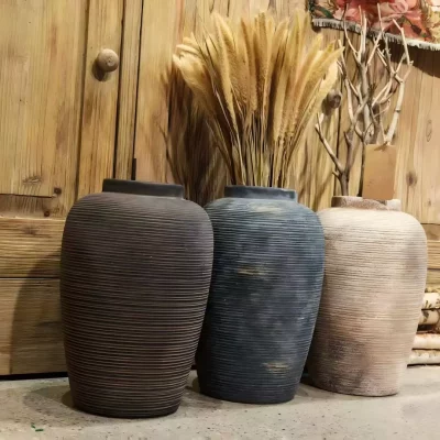Ribbed ceramic vases that hold the quiet beauty of imperfection.