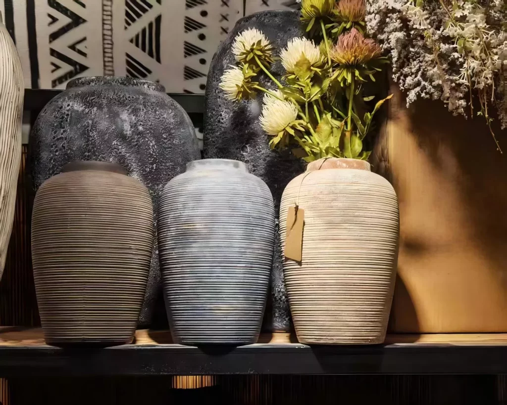 Ribbed ceramic vases that hold the quiet beauty of imperfection.