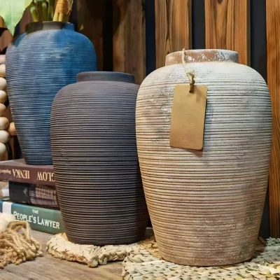 Ribbed ceramic vases that hold the quiet beauty of imperfection.