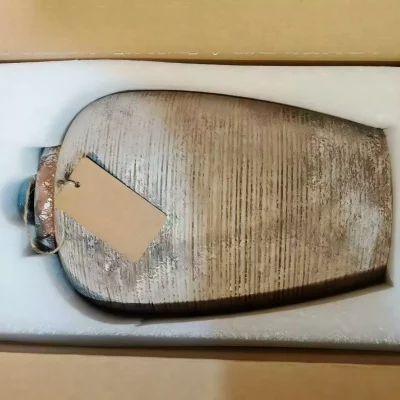 Ribbed ceramic vases that hold the quiet beauty of imperfection.