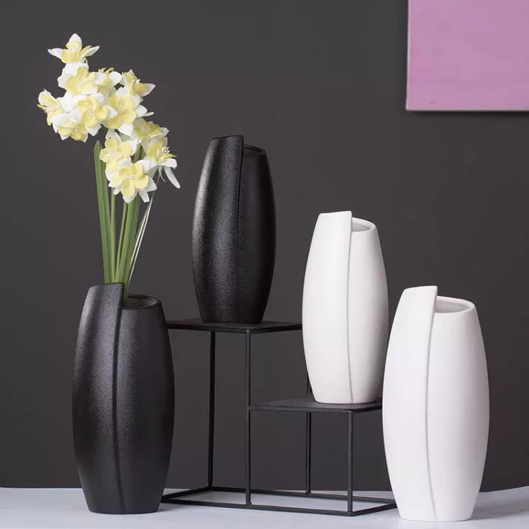 Black matte ceramic vase with vertical texture, modern home decor for flowers