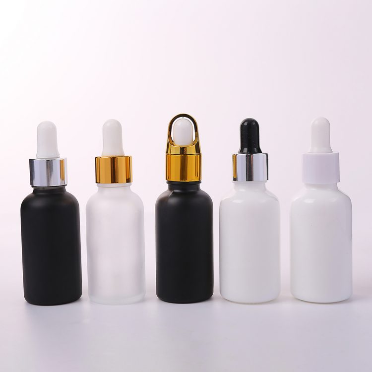 white essential oli glass bottle