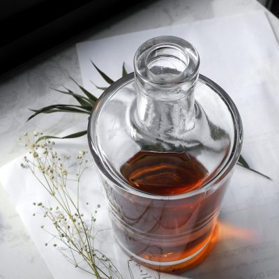 cylindrical whiskey bottle