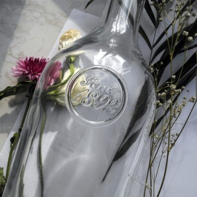 Transparent whiskey glass bottle