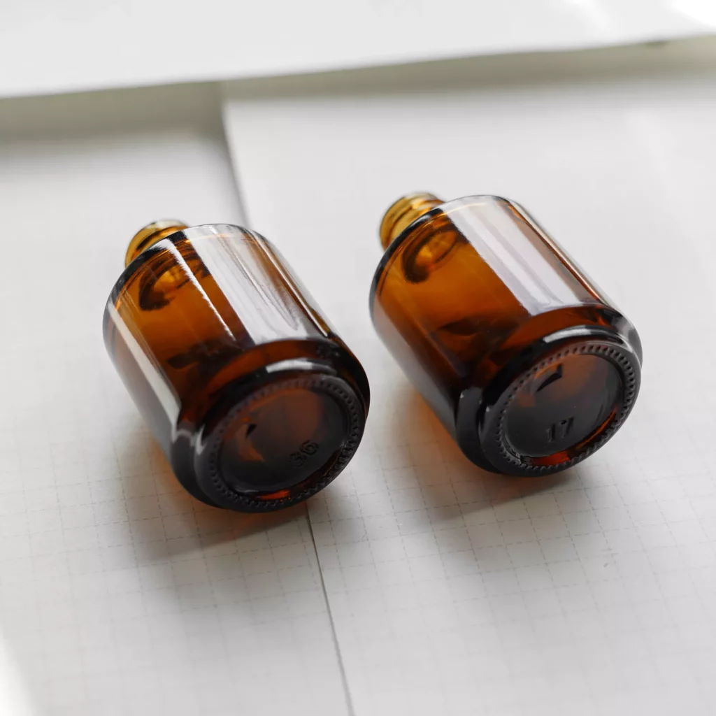 round glass essential oil  bottle